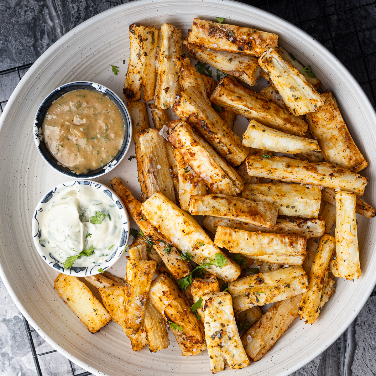 Top down view of a plate of crispy yucca fries.
